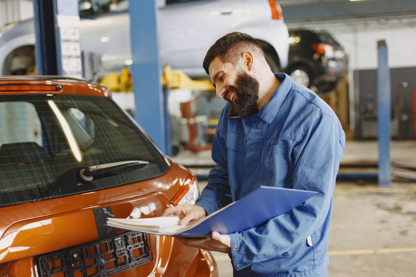 Workshop advisor preparing a costed inspection sheet for a customer